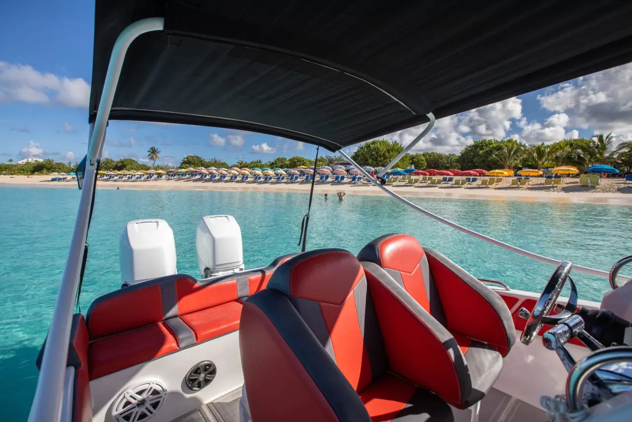 Cigarette 36 cockpit shaded by its bimini top